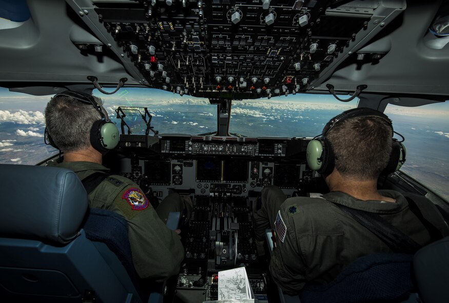 General Paul Selva, Air Mobility Command commander, takes control of C-17 Globemaster III, P-223, mid-flight during the inaugural flight of the final U.S. Air Force C-17 Sept. 12, 2013. Lt. Gen. James Jackson, Air Force Reserve commander, performed the take-off from California and Lt. Gen. Stanley Clarke, Air National Guard director, landed the aircraft at Joint Base Charleston, S.C. This historical event comes more than 20 years after the 437th Airlift Wing and the 315th Airlift Wing took delivery of the very first C-17 to enter the Air Force inventory June 14, 1993 and marks the successful completion of C-17 production for the U.S. Air Force. (U.S. Air Force photo/ Senior Airman Dennis Sloan)