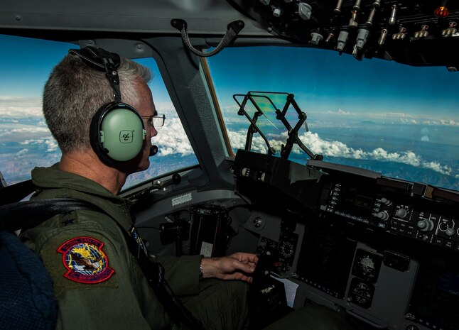 General Paul Selva, Air Mobility Command commander, takes control of C-17 Globemaster III, P-223, mid-flight during the inaugural flight of the final U.S. Air Force C-17 Sept. 12, 2013. Lt. Gen. James Jackson, Air Force Reserve commander, performed the take-off from California and Lt. Gen. Stanley Clarke, Air National Guard director, landed the aircraft at Joint Base Charleston, S.C. This historical event comes more than 20 years after the 437th Airlift Wing and the 315th Airlift Wing took delivery of the very first C-17 to enter the Air Force inventory June 14, 1993 and marks the successful completion of C-17 production for the U.S. Air Force. (U.S. Air Force photo/ Senior Airman Dennis Sloan)