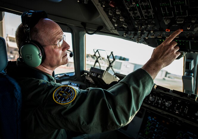 Lt. Gen. James Jackson, Air Force Reserve commander, performs pre-flight checks on the final U.S. Air Force C-17 Globemaster III, P-223, Sept. 12, 2013, at Long Beach, Calif. Jackson performed the take-off from California with Gen. Paul Selva, Air Mobility Command commander, taking over mid-flight and Lt. Gen. Stanley Clarke, Air National Guard director, landing the aircraft at Joint Base Charleston, S.C. This historical event comes more than 20 years after the 437th Airlift Wing and the 315th Airlift Wing took delivery of the very first C-17 to enter the Air Force inventory June 14, 1993 and marks the successful completion of C-17 production for the U.S. Air Force. (U.S. Air Force photo/ Senior Airman Dennis Sloan)