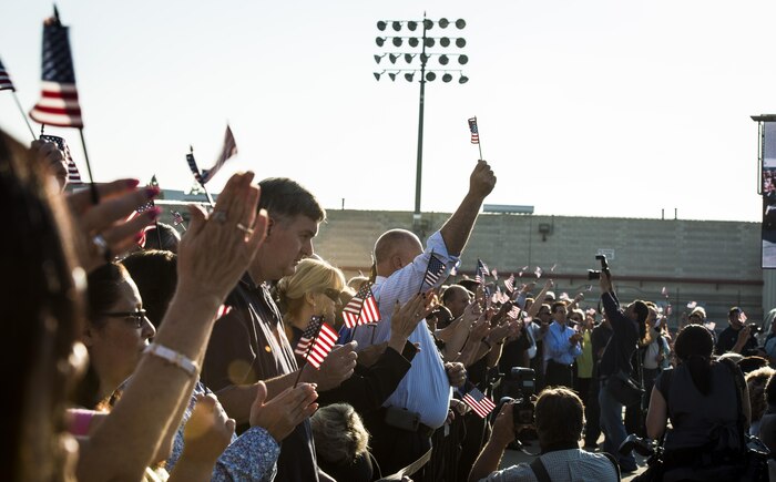 Boeing employees who work on the production of the C-17 Globemaster III wave American flags in support of the military during the final U.S. Air Force C-17 Globemaster III, P-223, delivery ceremony Sept. 12, 2013, at Long Beach, Calif. The C-17 was flown from California to Joint Base Charleston, S.C., by pilots to include Gen. Paul Selva, Air Mobility Command commander, Lt. Gen. James Jackson, Air Force Reserve commander, and Lt. Gen. Stanley Clarke, Air National Guard director. This historical event comes more than 20 years after the 437th Airlift Wing and the 315th Airlift Wing took delivery of the very first C-17 to enter the Air Force inventory June 14, 1993 and marks the successful completion of C-17 production for the U.S. Air Force. (U.S. Air Force photo/ Senior Airman Dennis Sloan)