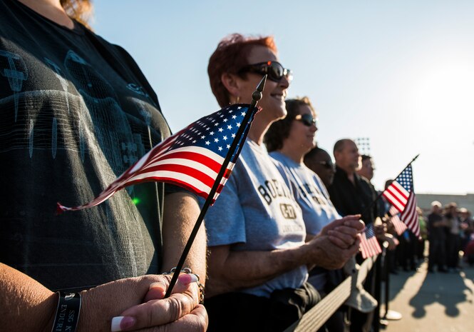 Boeing employees who work on the production of the C-17 Globemaster III hold American flags in support of the military during the final U.S. Air Force C-17 Globemaster III, P-223, delivery ceremony Sept. 12, 2013, at Long Beach, Calif. The C-17 was flown from California to Joint Base Charleston, S.C., by pilots to include Gen. Paul Selva, Air Mobility Command commander, Lt. Gen. James Jackson, Air Force Reserve commander, and Lt. Gen. Stanley Clarke, Air National Guard director. This historical event comes more than 20 years after the 437th Airlift Wing and the 315th Airlift Wing took delivery of the very first C-17 to enter the Air Force inventory June 14, 1993 and marks the successful completion of C-17 production for the U.S. Air Force. (U.S. Air Force photo/ Senior Airman Dennis Sloan)
