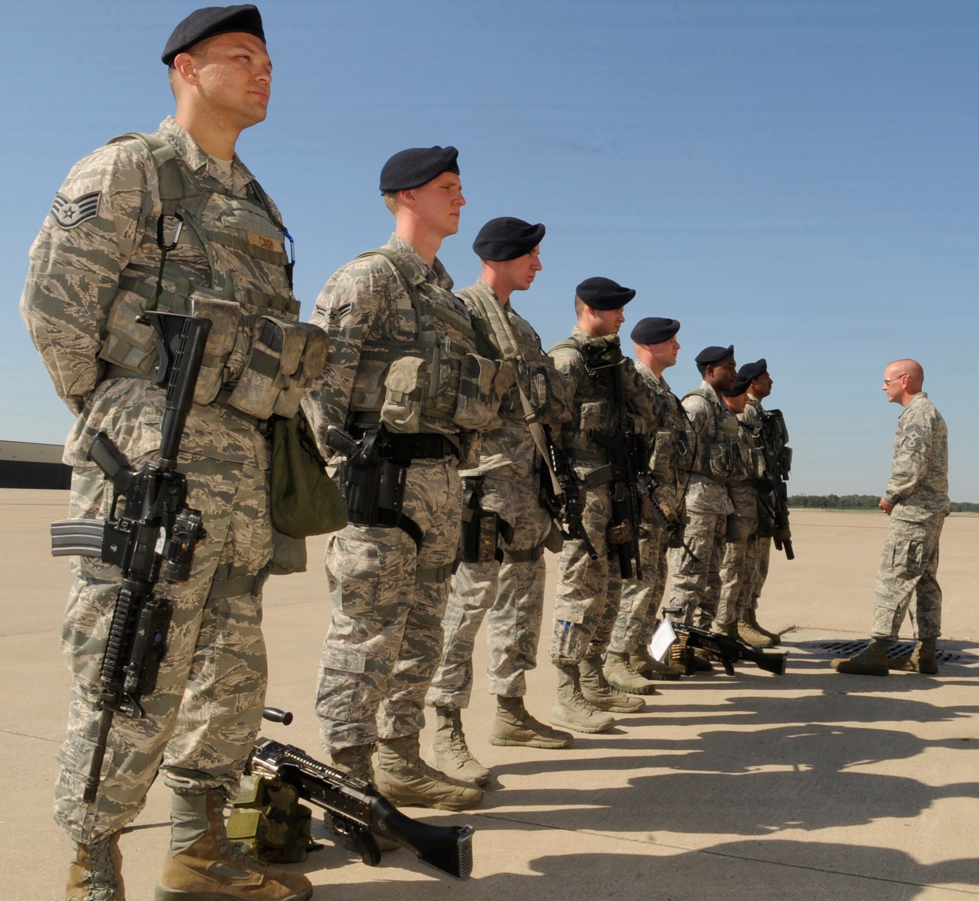 U.S. Air Force Chief Master Sgt. Brian Hornback, Air Force Global Strike Command command chief, listens to 509th Security Forces Squadron Airmen recite their post briefings during a visit to Whiteman Air Force Base, Mo., Sept. 6, 2013. Hornback visited the bomb wing staff agencies, security forces squadron and flightline units. (U.S. Air Force photo by Staff Sgt. Alexandra M. Boutte/Released)