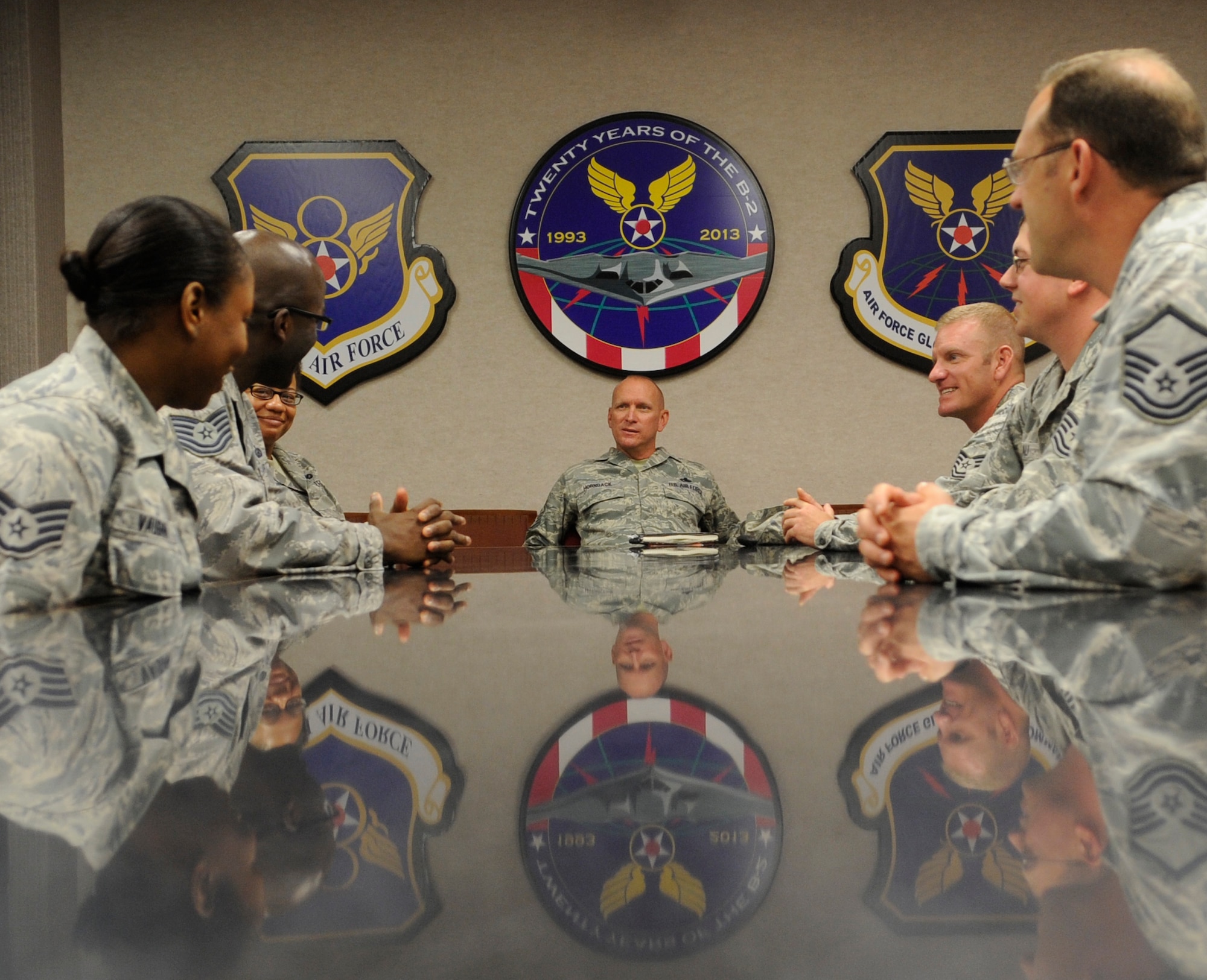 U.S. Air Force Chief Master Sgt. Brian Hornback, Air Force Global Strike Command command chief, sits down with 509th Bomb Wing staff agency Airmen during a visit, Sept. 6, 2013. Hornback spoke with Airmen around the wing about the Air Force careers and concerns. (U.S. Air Force photo by Staff Sgt. Alexandra M. Boutte/Released)