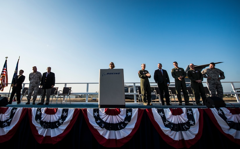 U.S. Air Force leaders stand on stage during a ceremony held by Boeing commemorating the final U.S. Air Force C-17 Globemaster III, P-223 Sept. 12, 2013, at Long Beach, Calif. The C-17 was flown from California to Joint Base Charleston, S.C., by pilots to include Gen. Paul Selva, Air Mobility Command commander, Lt. Gen. James Jackson, Air Force Reserve commander, and Lt. Gen. Stanley Clarke, Air National Guard director. This historical event comes more than 20 years after the 437th Airlift Wing and the 315th Airlift Wing took delivery of the very first C-17 to enter the Air Force inventory June 14, 1993 and marks the successful completion of C-17 production for the U.S. Air Force. (U.S. Air Force photo/ Senior Airman Dennis Sloan)
