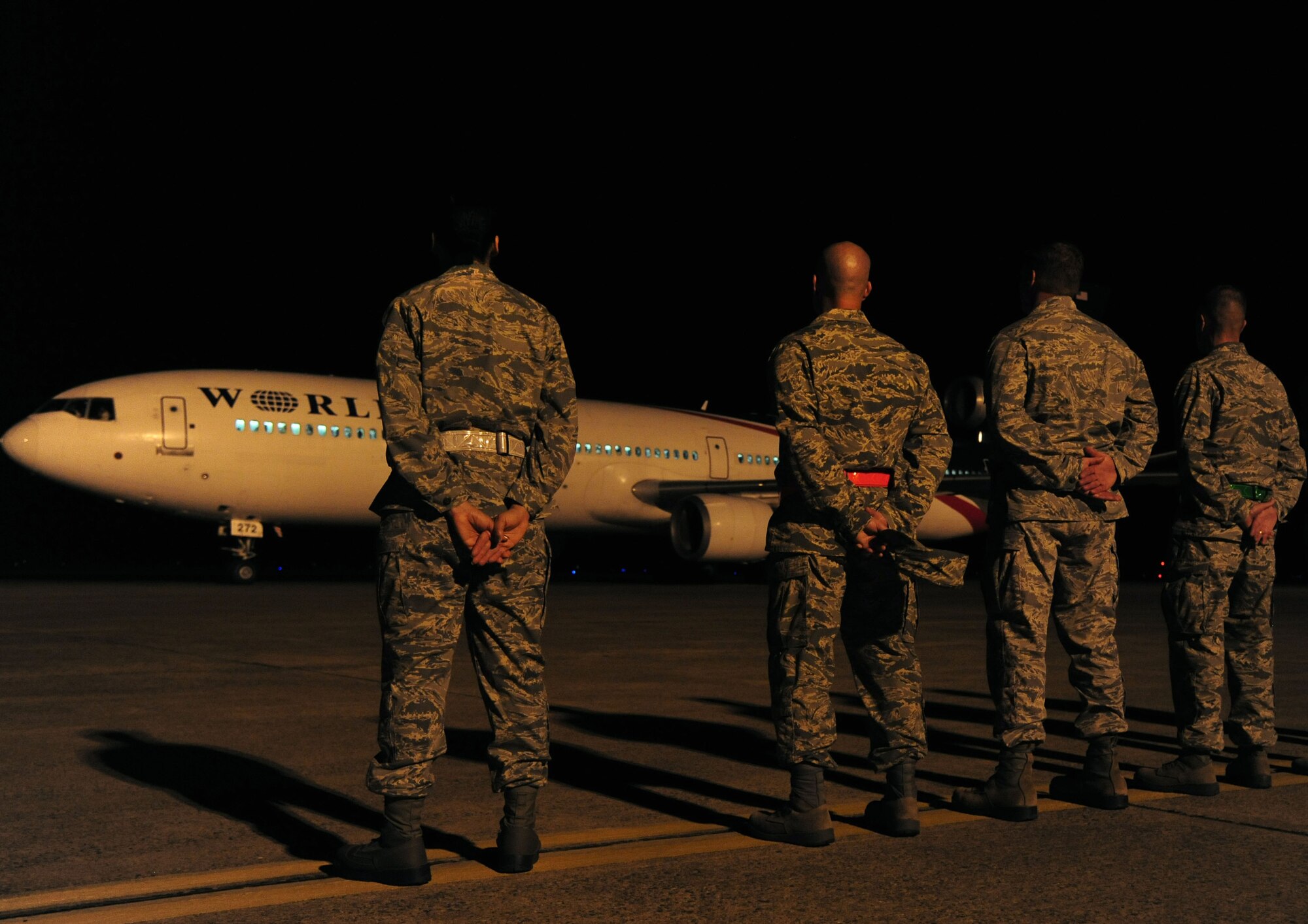 Leadership from the 19th Airlift Wing stands as an aircraft with deployers takes off Sept. 8, 2013, at Little Rock Air Force Base, Ark. Team Little Rock leadership came out to wish the Airmen good luck on their deployment. (U.S. Air Force photo by Senior Airman Kaylee Clark)