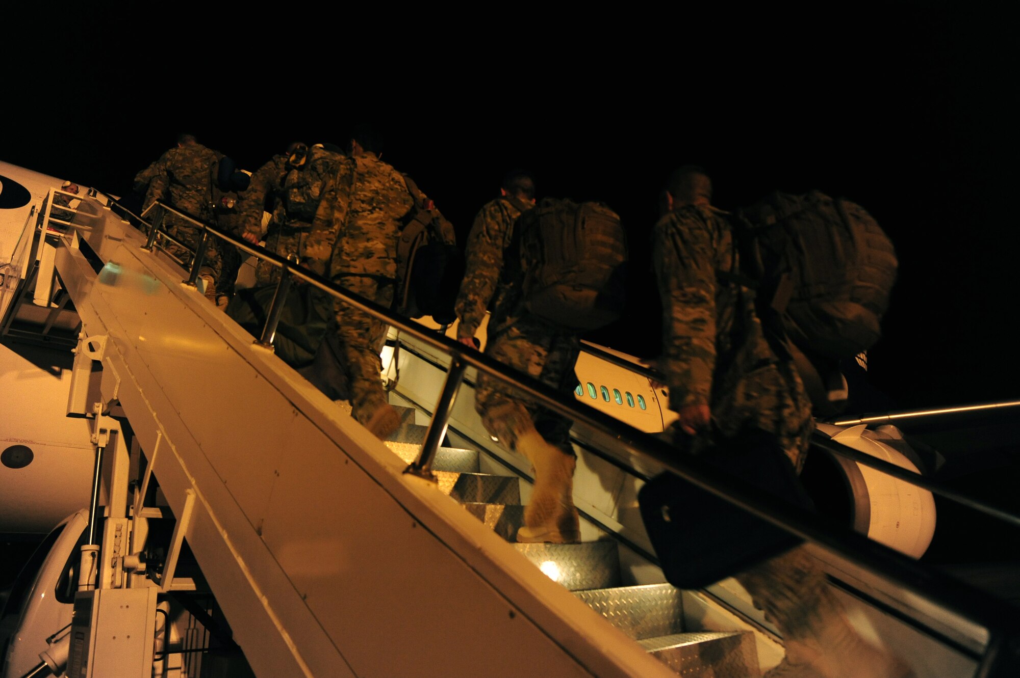 Team Little Rock members from the 19th Airlift Wing board a plane for deployment Sept. 8, 2013, at Little Rock Air Force Base, Ark. At any given time there are approximately 600 Airmen deployed from Little Rock AFB. (U.S. Air Force photo by Senior Airman Kaylee Clark)