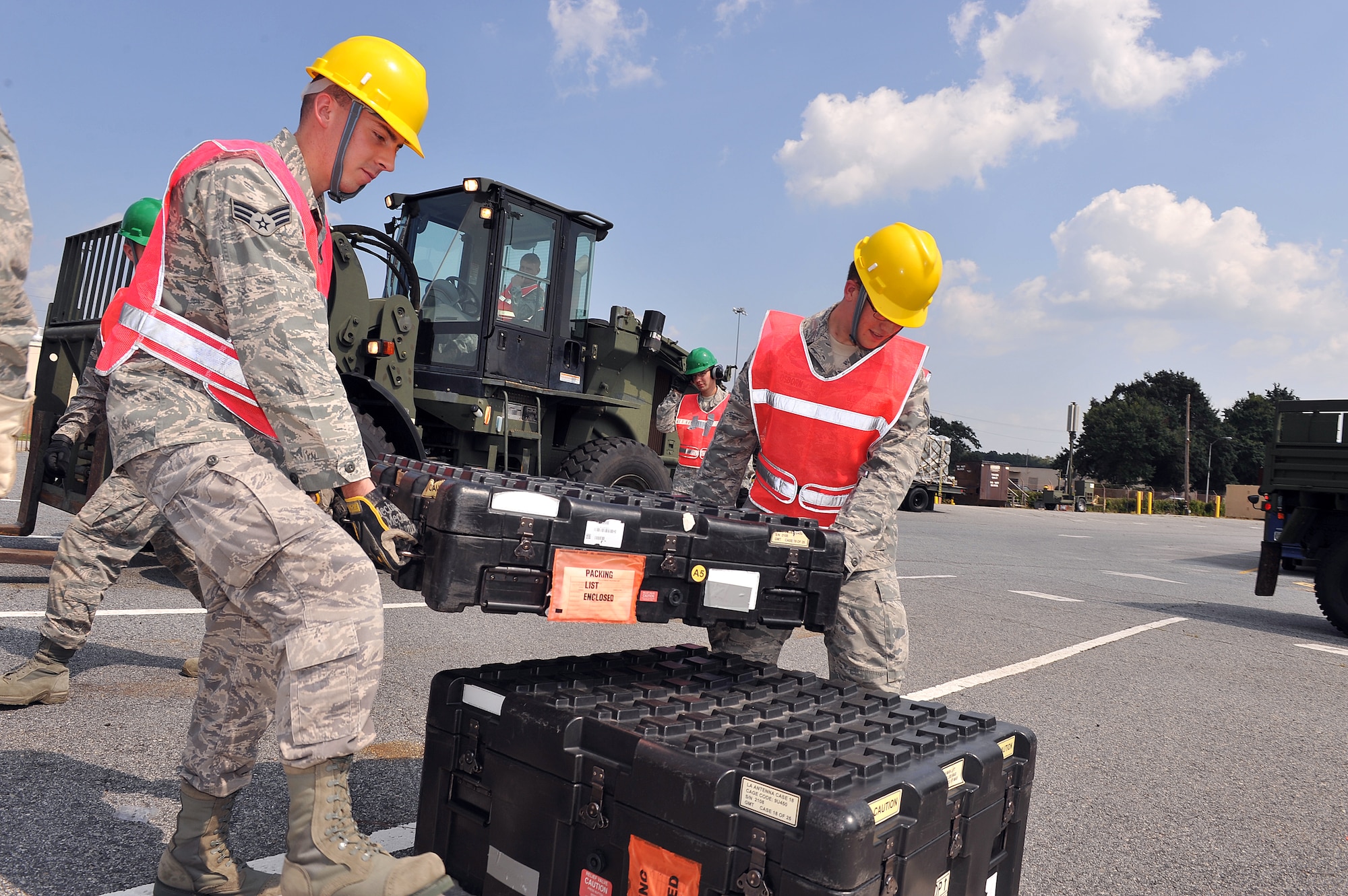 Senior Airmen Edwin Chapman (left) and Nathaniel Osborn, 52nd Combat Communications, cyber transport systems technicians, load equipment to be transported with them for a two-week exercise in which the 52nd CBCS will embed with the 712th Air Support Operations Squadron at Fort Hood, Texas. (U.S. Air Force photo by Tommie Horton)