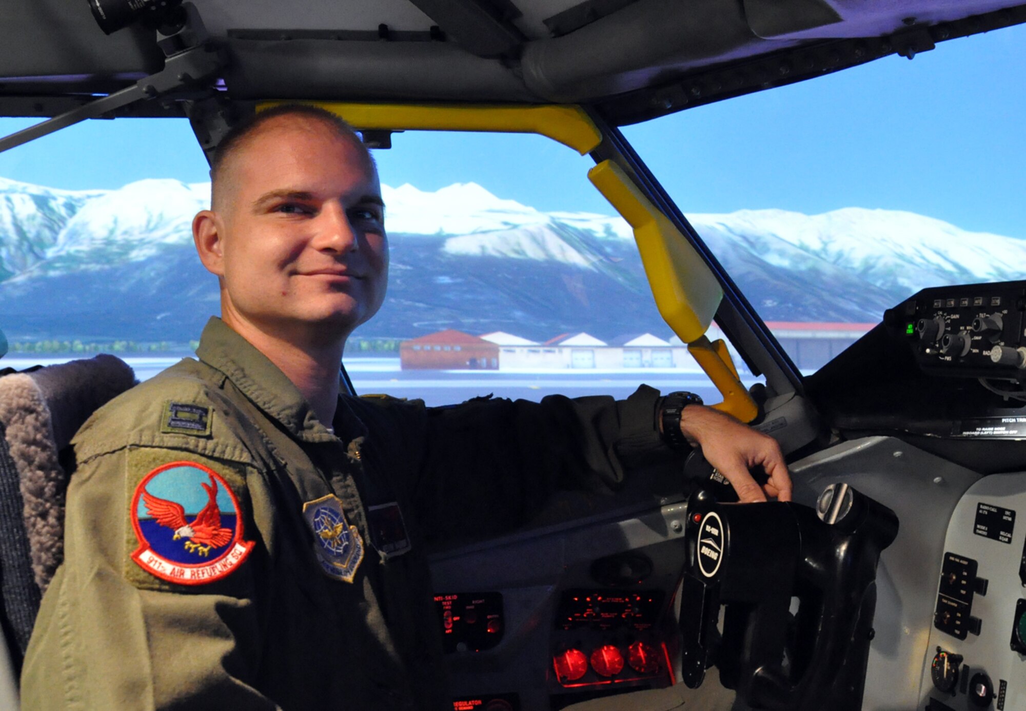 Capt. Kevin Badinski, pilot with the 911th Air Refueling Squadron, prepares for takeoff in the KC-135 simulator here. The newly updated simulator graphics can accurately display runway environments from around the world.  (USAF photo by SSgt. Alan Abernethy, 916ARW/PA)
