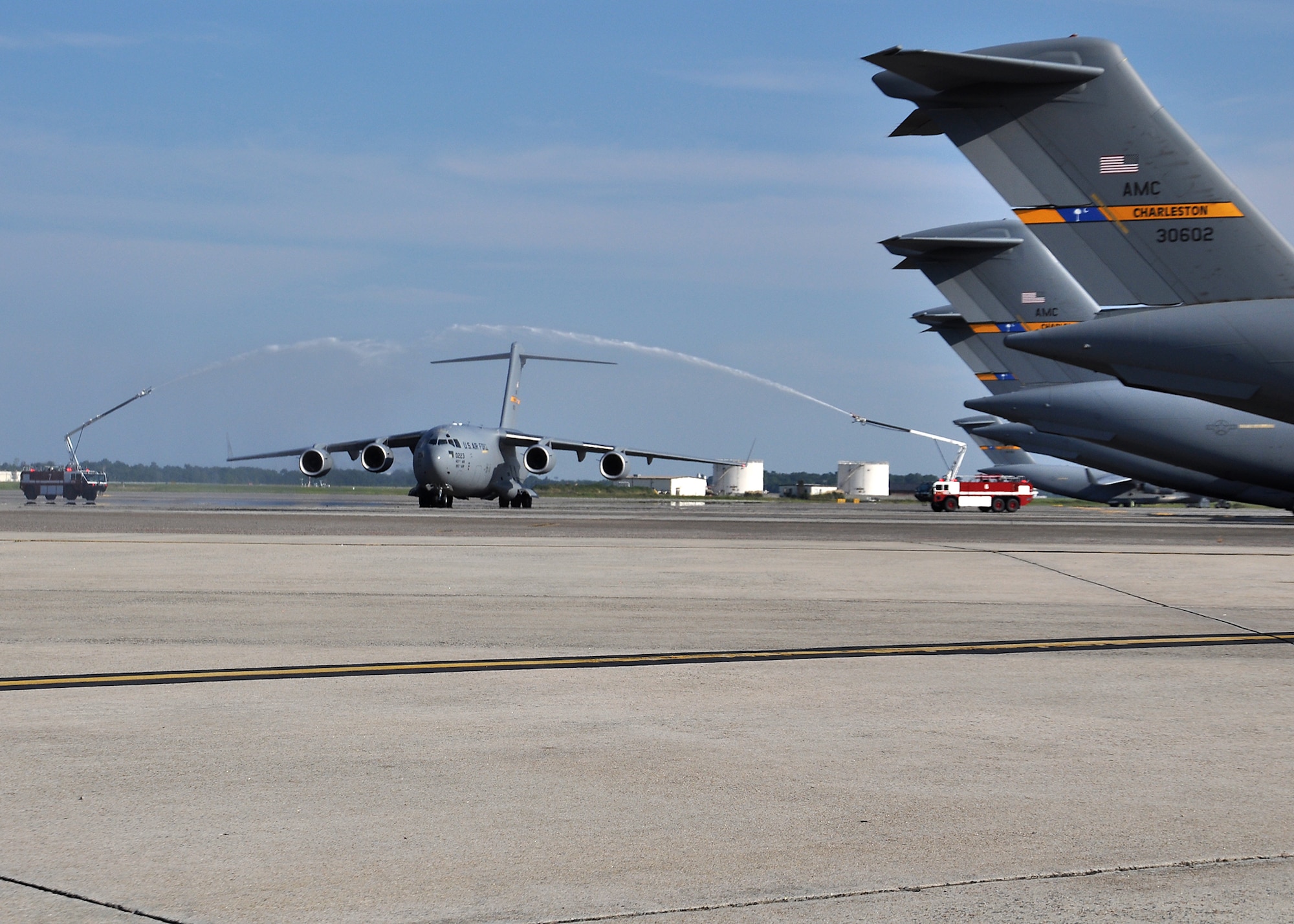 P-223, the final Air Force C-17, taxis under an arch of water during a grand ceremony celebrating 20 years of the C-17 Globemaster III Sept. 12 at Joint Base Charleston, S.C. (U.S. Air Force photo / Michael Dukes)