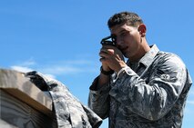 U.S. Air Force Senior Airman Thad Taylor, 15th Air Support Operations Squadron radio operator, maintainer and driver (ROMAD) scopes a target for an F-15E Strike Eagle to drop ordnance on at the Dare County Bomb Range in Stumpy Point, N.C., Aug. 26, 2013.  The training combined resources from the 336th Fighter Squadron and the 15th ASOS to help aircrew and joint terminal attack controllers maintain currencies and get real-world integration with each other.  (U.S. Air Force photo by Airman 1st Class Brittain Crolley)