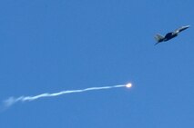 A pilot assigned to the 336th Fighter Squadron, Seymour Johnson Air Force Base, N.C., launches a training ordnance at the Dare County Bomb Range in Stumpy Point, N.C., Aug. 26, 2013.  The weeklong training consisted of F-15E Strike Eagle pilots dropping multiple practice bombs on simulated targets in coordination with joint terminal attack controllers.  (U.S. Air Force photo by Airman 1st Class Brittain Crolley)