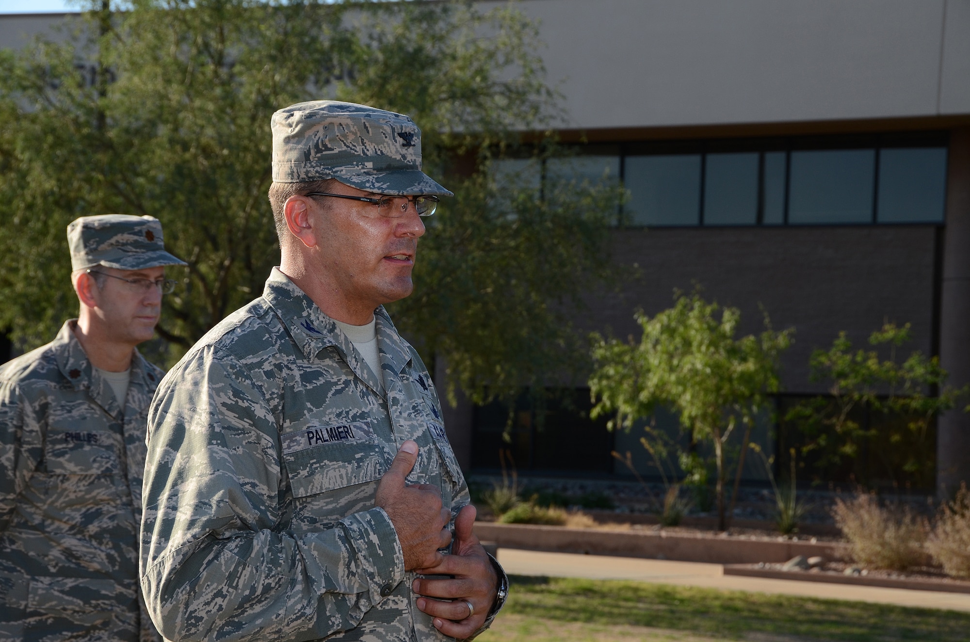 Col. Richard Palmieri, commander of the 612th Air Communication Squadron (ACOMS), talks with members of the   his squadron at the end of their march around Davis-Monthan AFB, Ariz., in remembrance of the 9/11 victims, Sept. 11, 2013.  (USAF photo by Staff Sgt. Heather Redman/Released)