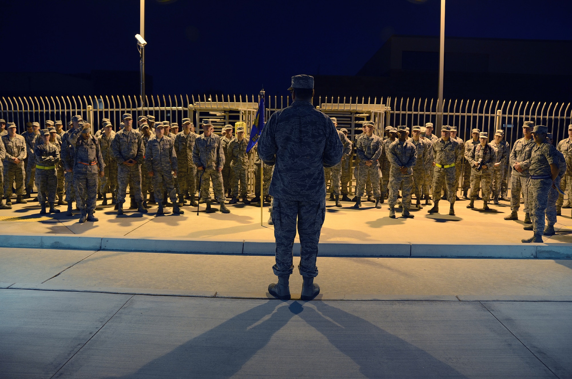 Col. Richard Palmieri, commander of the 612th Air Communication Squadron (ACOMS), talks to members  of his squadron about the importance of remembering the events that occurred on 9/11 before the squadron began a memorial march around Davis-Monthan AFB, Ariz., Sept. 11, 2013.  Throughout the march the squadron stopped at key times that correlated with the attacks in New York, Washington D.C., and Pennsylvania. (USAF photo by Staff Sgt. Heather Redman/Released)