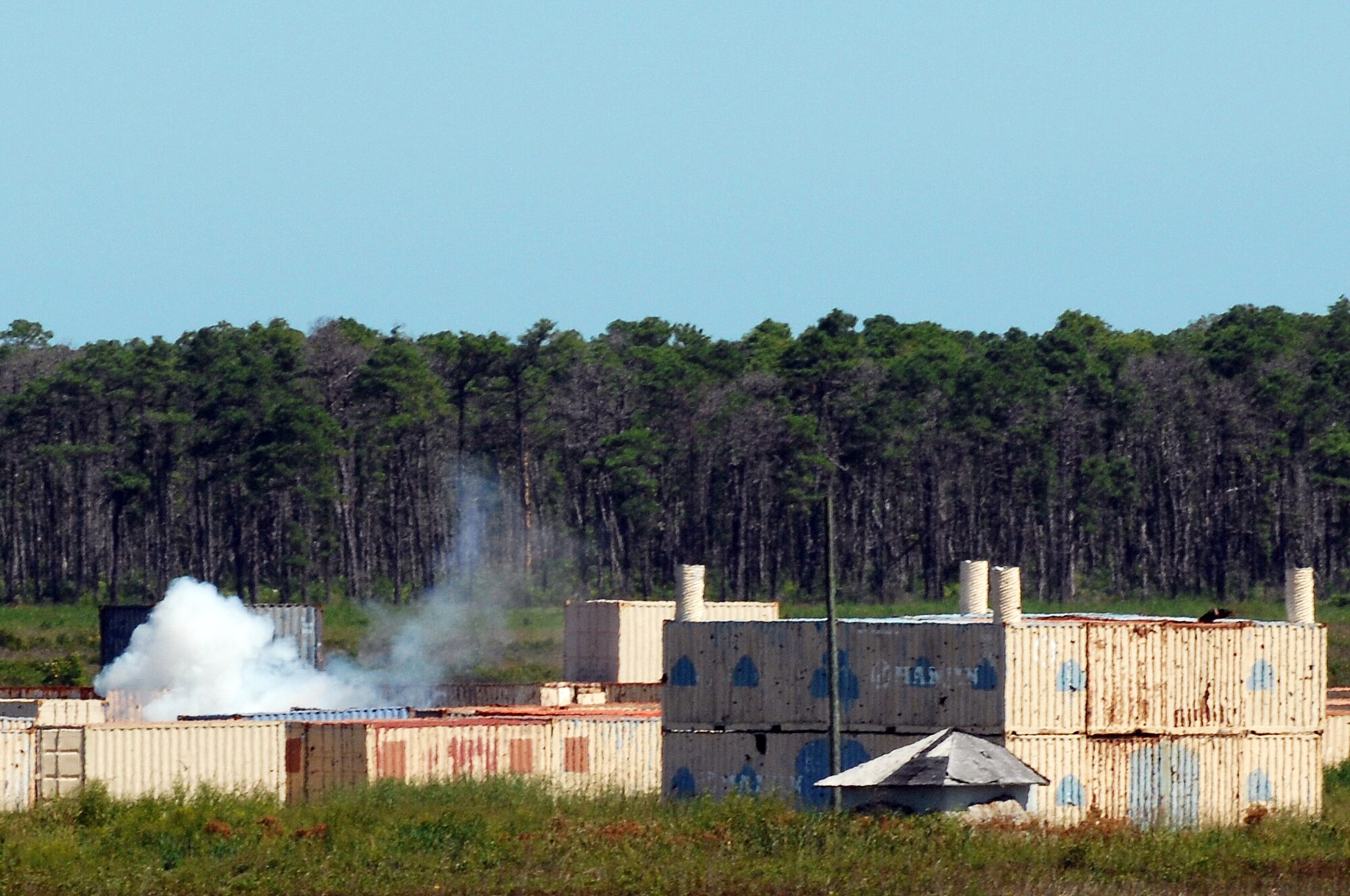 Training ordnance from an F-15E Strike Eagle hits its target during joint terminal attack controller training at the Dare County Bomb Range in Stumpy Point, N.C., Aug. 26, 2013.  Members of the 336th Fighter Squadron, Seymour Johnson Air Force Base, N.C., and the 15th Air Support Operations Squadron, Fort Stewart, Ga., coordinated resources to complete the weeklong training.  (U.S. Air Force photo by Airman 1st Class Brittain Crolley)
