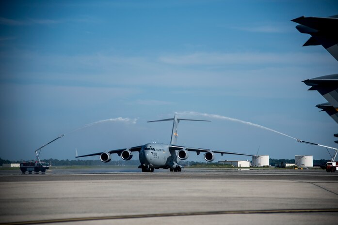 The final U.S. Air Force C-17 Globemaster III, P-223, gets hosed down Sept. 12, 2013, during the beginning of the delivery  ceremony at Joint Base Charleston - Air Base, S.C. This historical event comes more than 20 years after the 437th Airlift Wing and the 315th Airlift Wing took delivery of the very first C-17 to enter the Air Force inventory June 14,1993 and marks the successful completion of C-17 production for the U.S. Air Force. (U.S. Air Force photo/Tech. Sgt. Rasheen Douglas)