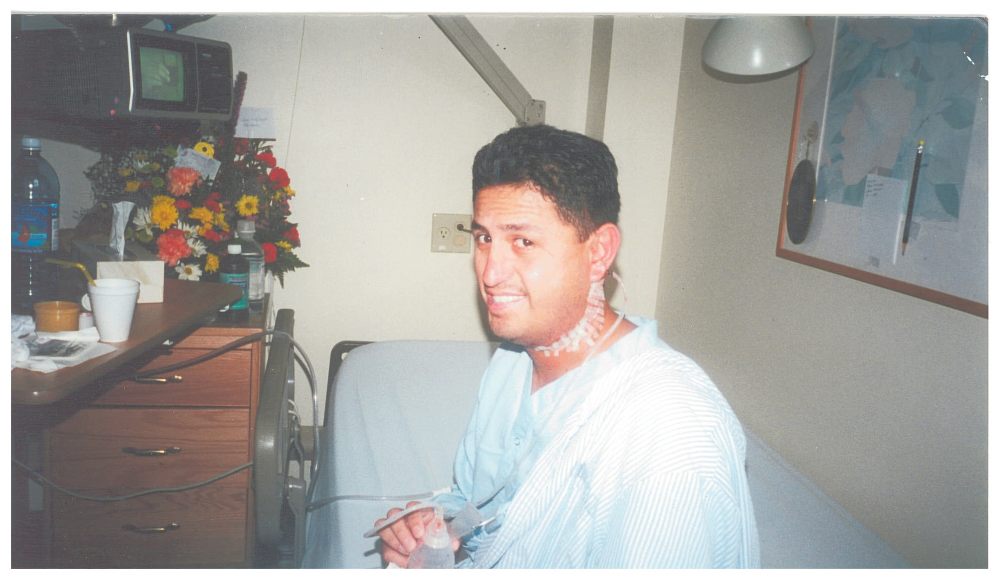 In 2000, then Tech. Sgt. John Acosta sat in a hospital bed at Tripler Army Medical Center in Honolulu recovering from surgery that required the removal of his left jaw bone to remove a fast-growing tumor in an 18-hour long surgery. Months of recovery and therapy would follow. (Courtesy photo)