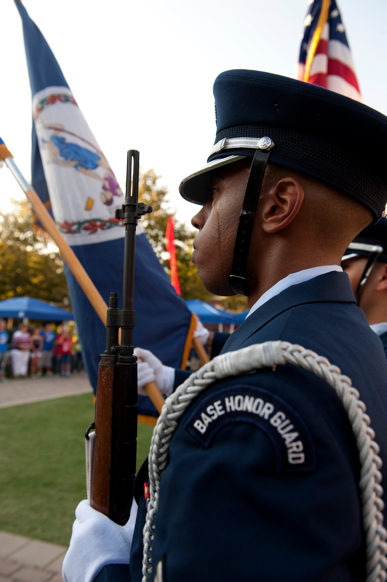 U.S. Air Force Senior Airman Gregory Peterson stands at attention during the posting of the colors the September 11 Memorial Ceremony Sept. 11, 2013 in Hampton, Va. The honor guard took part in one of the many events scheduled world-wide to remember and honor all Americans who have been affected by the attacks 12 years ago. (U.S. Air Force Photo/Sachel Seabrook)