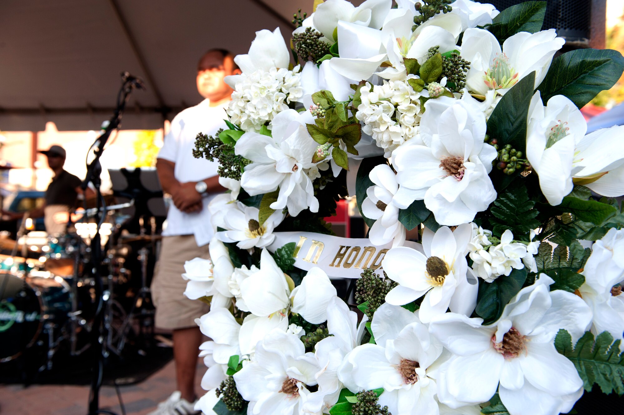 A wreath is placed on the stage at Peninsula Town Center, Hampton Va., during the September 11 Memorial Ceremony September 11, 2013. The death toll of the attacks was 2,997 people, including the 19 hijackers. The majority of casualties were civilians, including more than 70 foreign nationals. (U.S. Air Force Photo/Sachel Seabrook)