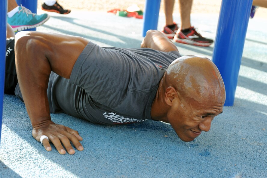 Siddig Mirghani, 56th Aerospace Medicine Squadron, works through the first event at a strong pace at the Warrior Fitness Challenge Sept. 6 at Luke Air Force Base. The final event was in memory of the 19 Granite Mountain Hotshots who lost their lives July 1 fighting the Yarnell Hill Fire in Central Arizona. (U.S. Air Force photo/Airman 1st Class Pedro Mota)