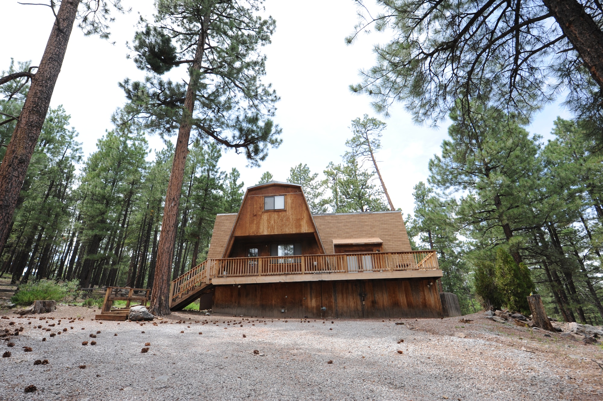 A multifamily A-frame cabin stands among pine trees inside the Fort Tuthill recreation area. The three-bedroom cabin features a full kitchen, dining room, two decks, fire pit and charcoal grill, and can accommodate up to 12 guests. Single-family A-frame units are also available, accommodating up to six guests and a hotel offering clean, comfortable rooms at affordable rates. (U.S. Air Force photo/Staff Sgt. Nestor Cruz)