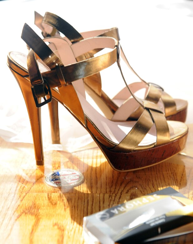 A pair of heels sits waiting for their wearer before the B-2 Fabulous Fashion Show at Whiteman Air Force Base, Mo., Sept. 6, 2013. The Cinderella’s Closet offers a wide selection of heels but is always looking for more donations. (U.S. Air Force photo by Airman 1st Class Shelby R. Orozco/Released)