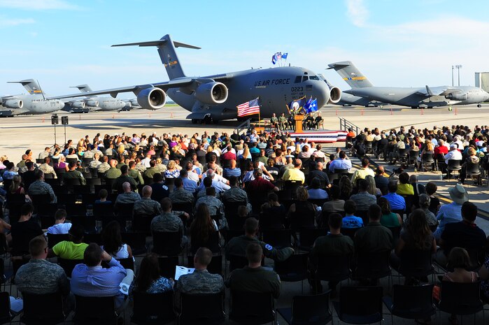 An audience listens to guest speakers during a ceremony held to commemorate the delivery of the final U.S. Air Force C-17 Globemaster III, P-223,  Sept. 12, 2013, on the flight line at JB Charleston - Air Base, S.C. This historical event comes more than 20 years after the 437th Airlift Wing and the 315th Airlift Wing took delivery of the very first C-17 to enter the Air Force inventory June 14, 1993 and marks the successful completion of C-17 production for the U.S. Air Force. (U.S. Air Force photo/ Airman 1st Class Chacarra Neal)