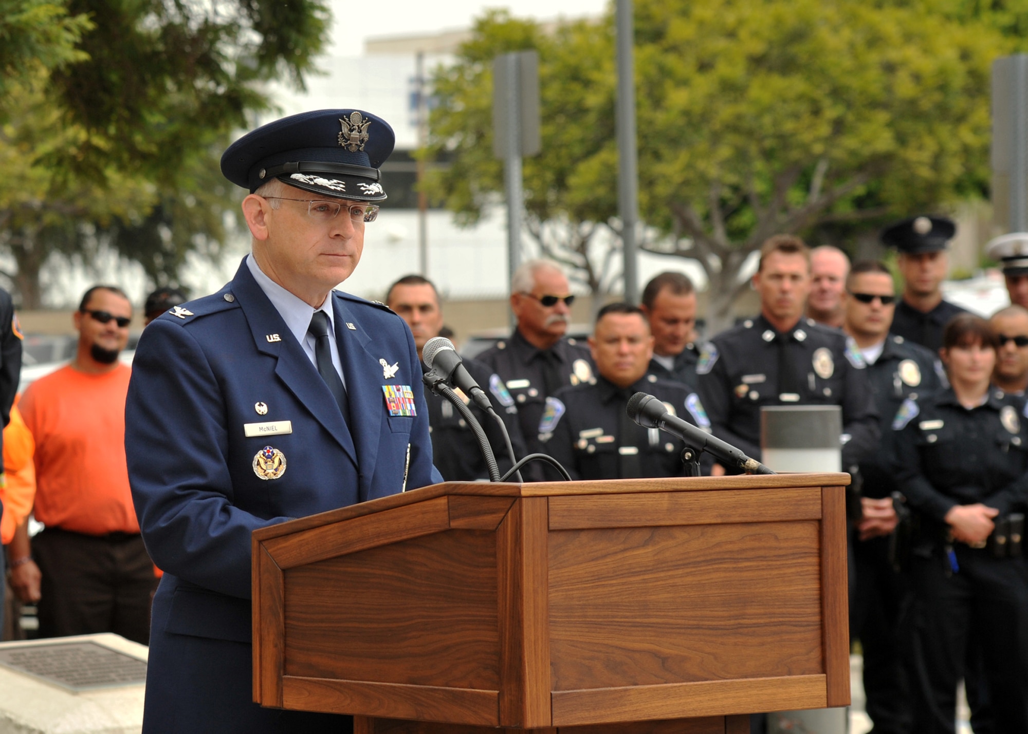 U.S. Air Force Col. Samuel L. McNiel, Commander, 61st Air Base Group, Los Angeles Air Force Base, addresses a crowd of civil servants of the Los Angeles County Fire Department, Hawthorne Police Department, U.S. Postal Service, Los Angeles County Sheriffs, paramedics and members of the Airline Pilots Association during the City of Hawthorne's 9/11 Ceremony.  The ceremony honors first responders and all Americans who lost their lives on that day in 2001.  (U.S. Air Force photo by Sarah Corrice.)