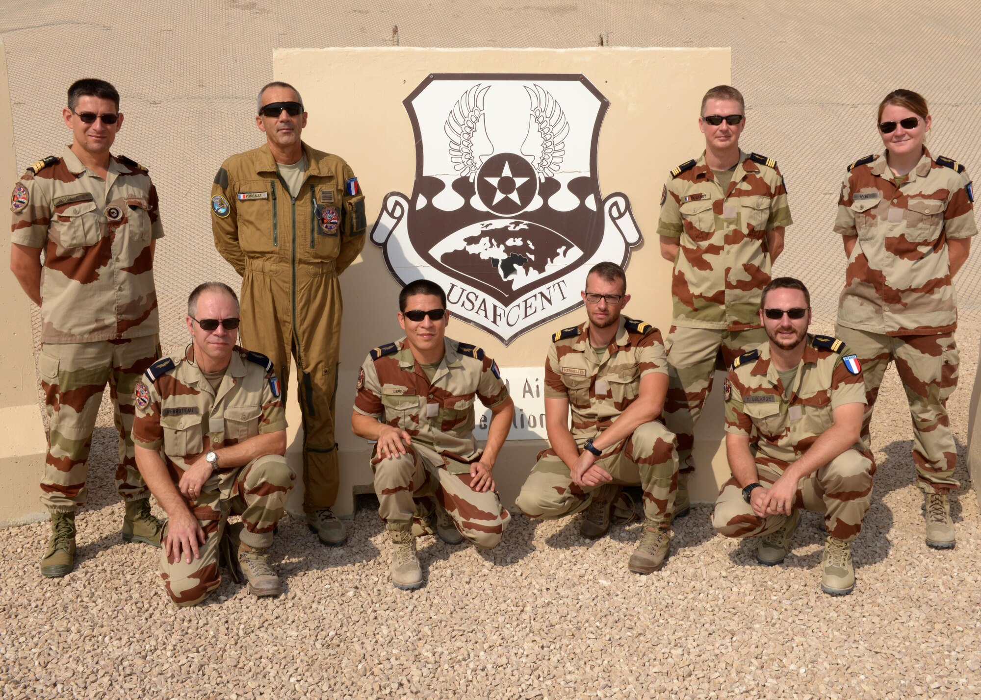 Members of the French Air Forces pose for a photo at the 379th Air Expeditionary Wing in Southwest Asia, Sept. 12, 2013. As liaisons for the French Air Force, their primary mission is to incorporate French aircraft and means into the Combined Air and Space Operations Center air tasking order as necessary to support operations here. (U.S. Air Force photo/Senior Airman Bahja J. Jones) 
