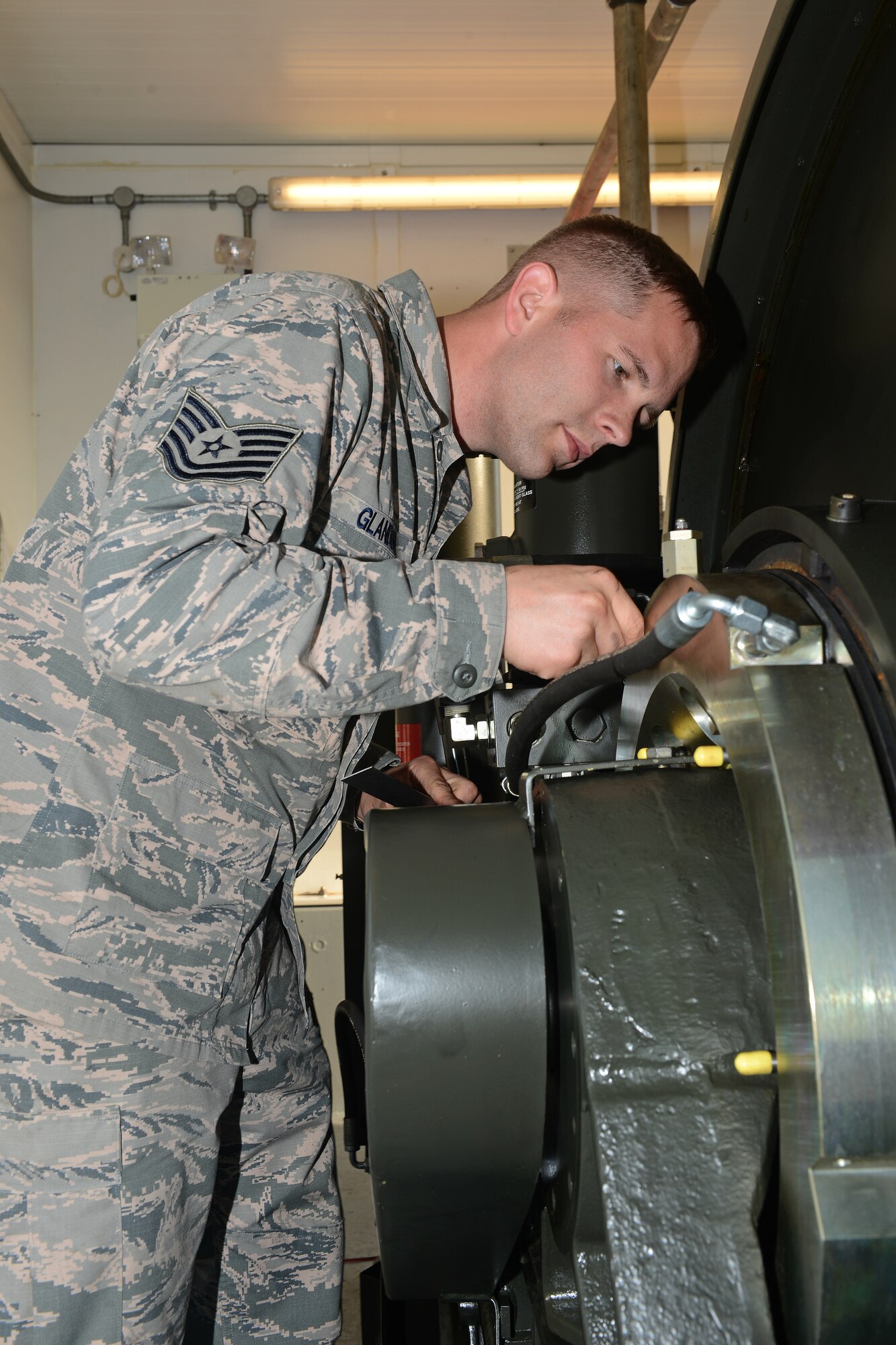 Tech. Sgt. Leslie Glandon, 48th Civil Engineer Squadron, performs maintenance on an aircraft arresting system at Royal Air Force Lakenheath, England, Sept. 12, 2013. Glandon was nominated for a Liberty Spotlight because he displays the core value of “Service Before Self.” (U.S. Air Force photo by Airman 1st Class Trevor T. McBride/Released) 