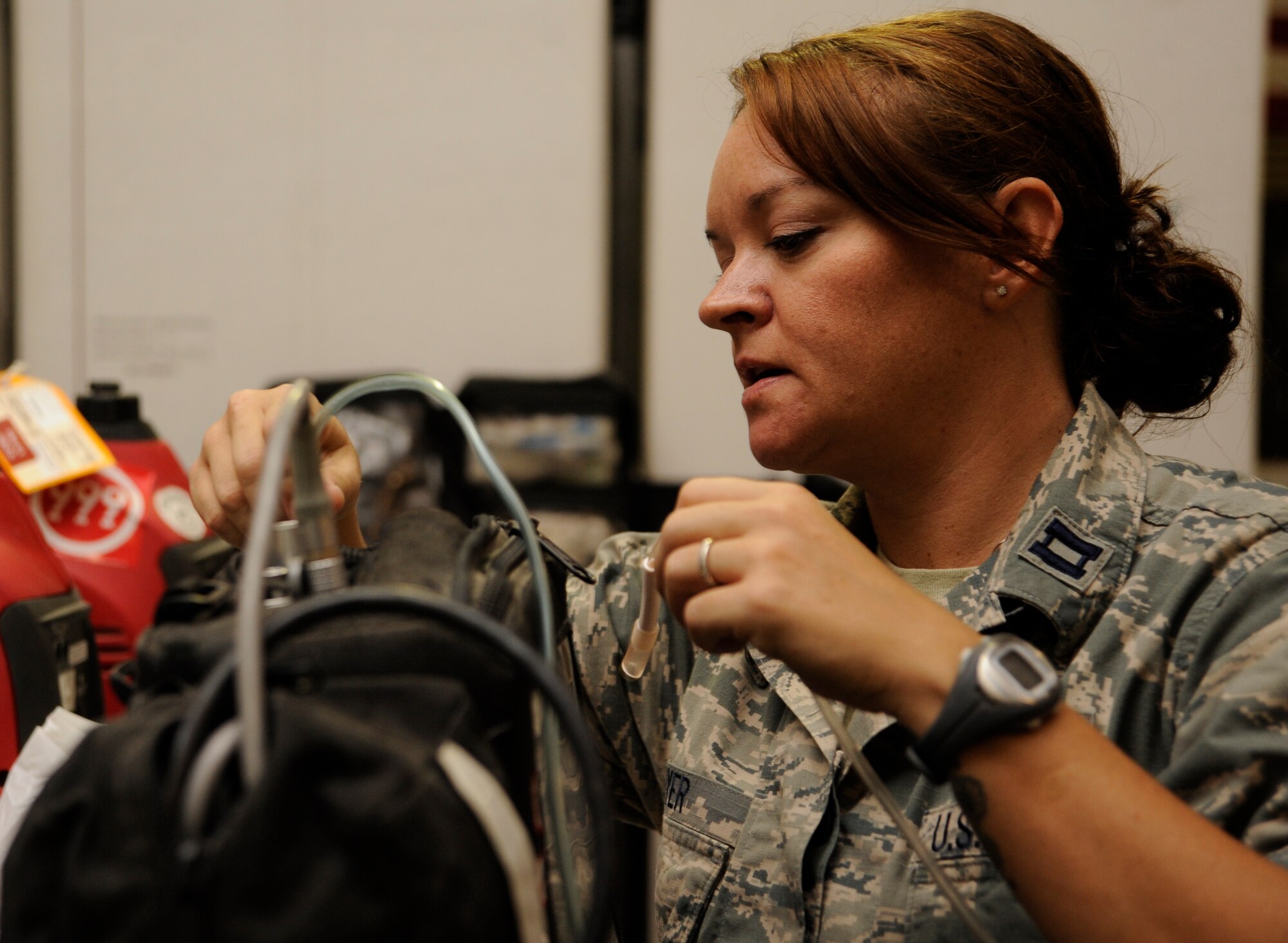 Capt. Cassidy Boyer connects an impact ventilator used to ventilate a patient under general anesthesia during a Mobile Field Surgical Team and Expeditionary Critical Care Team exercise at the 379th Air Expeditionary Wing in Southwest Asia, Sept. 6, 2013. Boyer is a 379th Expeditionary Medical Operations Squadron MFST certified nurse anesthetist deployed from Wright-Patterson Air Force Base, Ohio, and a Helena, Mont., native. (U.S. Air Force photo/Senior Airman Bahja J. Jones) 

