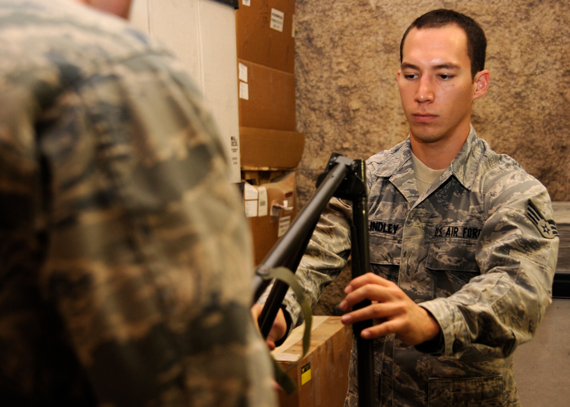 Senior Airman Richard Lindley puts together a medical litter stretcher stand during a Mobile Field Surgical Team and Expeditionary Critical Care Team exercise at the 379th Air Expeditionary Wing in Southwest Asia, Sept. 6, 2013. Lindley is a 379th Expeditionary Medical Operations Squadron MFST surgical services technician deployed from Joint Base Langley-Eustis, Va., and a Kaneohe, Hawaii, native. (U.S. Air Force photo/Senior Airman Bahja J. Jones)

