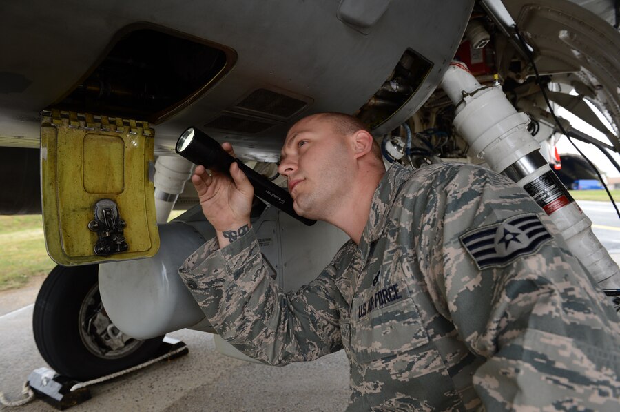 SPANGDAHLEM AIR BASE, Germany - U.S. Air Force Staff Sgt. William Ingram, 52nd Aircraft Maintenance Squadron electrical and environmental systems craftsman from Slidell, La., conducts a post-flight hydraulic engine differential pressure inspection Sept. 12, 2013. Aircraft maintainers provide pilots with fully functional aircraft allowing them to train and fight. This single unit maintains aircraft for the entire wing. (U.S. Air Force photo by Airman 1st Class Kyle Gese/Released)