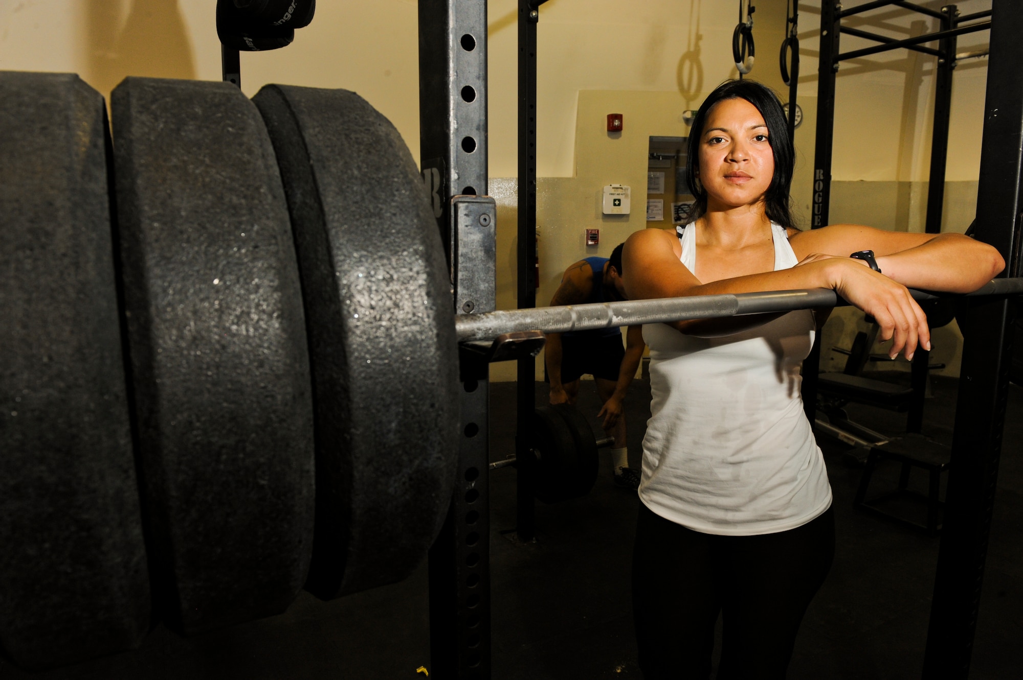 U.S. Air Force Staff Sgt. Vanessa Wyatt, 380th Expeditionary Civil Engineer Squadron, rest on the squat bar after a workout at an undisclosed location in Southwest Asia Sept. 11, 2013. Wyatt recently took second place in AFCENT's bi-annual "Strongest in the AOR" competition where she lifted a total of 650 pounds. Wyatt lifted 250 pounds during the squat portion of the competition. Wyatt is native to Orange, Calif., and is deployed from Nellis Air Force Base, Nev. (U.S. Air Force photo by Staff Sgt. Joshua J. Garcia)