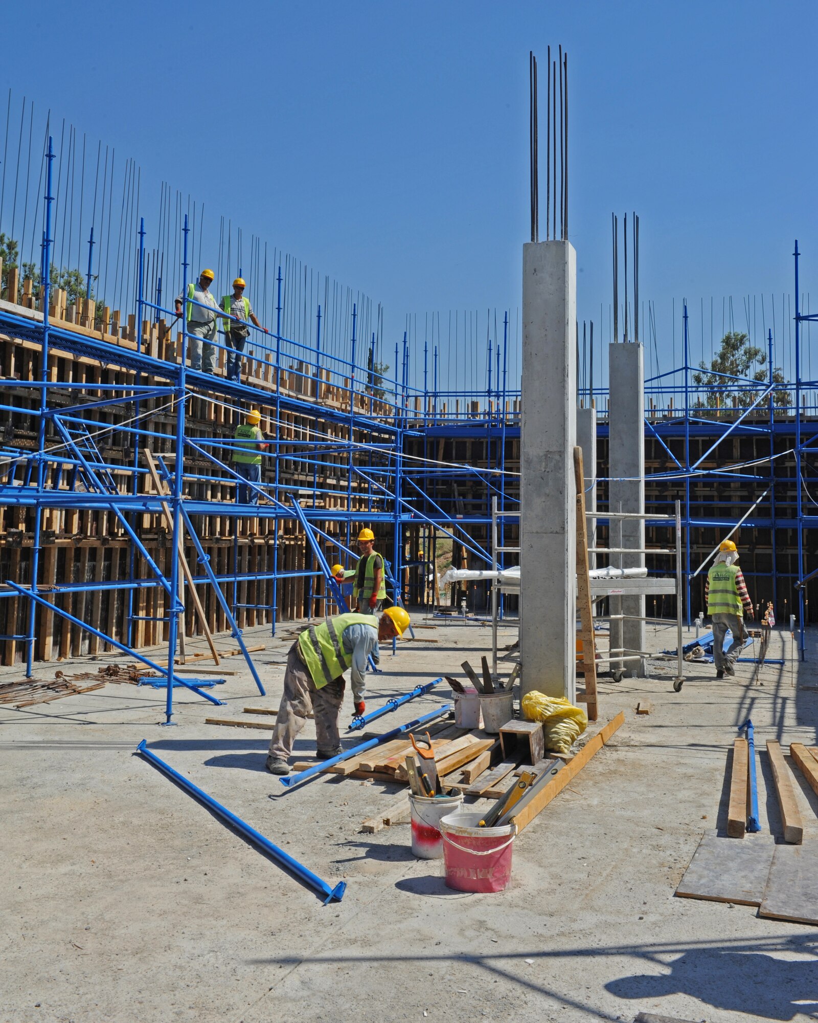 Contractors work on the Consolidated Community Center construction site on Sept. 12, 2013, at Incirlik Air Base, Turkey. Orken Dincer, U.S. Army Corps of Engineers project engineer said that he is happy with the quality of the construction. (U.S. Air Force photo by Senior Airman Chase Hedrick/Released)