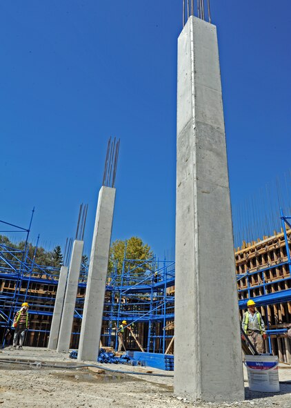 Concrete walls sit open to the sky during construction of the Consolidated Community Center on Sept. 12, 2013, at Incirlik Air Base, Turkey. The construction is on schedule to meet its planned opening in the fall of 2014. (U.S. Air Force photo by Senior Airman Chase Hedrick/Released)