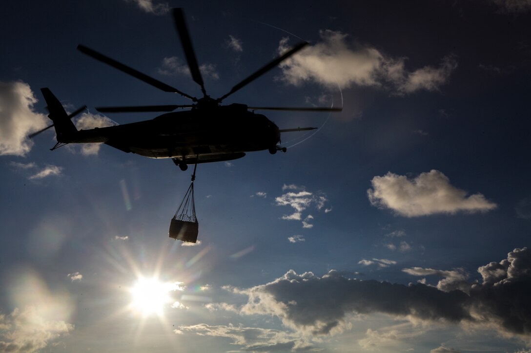 A CH-53E Super Stallion helicopter with Marine Medium Tiltrotor Squadron 265 (Reinforced), 31st Marine Expeditionary Unit, carries a load of cargo following an external lift from the flight deck here, Sept. 13. The Helicopter Support Team of CLB-31 and the crews of the helicopters play important roles in the 31st MEU’s capability to execute external lifts. The HST provides ground support to the CH-53E, which can lift up to 36,000 pounds. This lift capability can be used to overcome difficult terrain and land-based obstacles when executing logistical re-supply. The 31st MEU is the Marine Corps’ force in readiness in the Asia-Pacific region and the only continuously forward deployed MEU. 