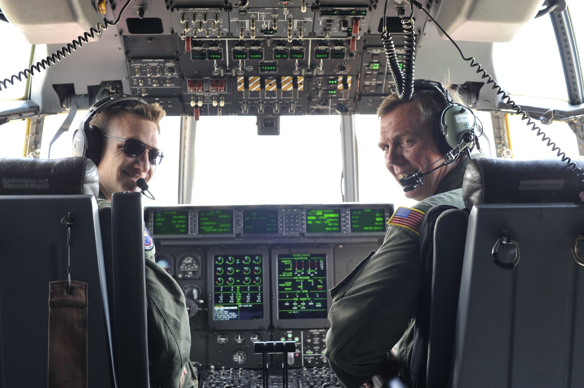 Capt. Chris Casler, 345th Airlift Squadron Pilot and Maj. Gen. Wallace W. "Wade" Farris Jr., 22nd Air Force Commander pose for a photo prior to take-off for a training flight conducted by the 345th and 815th Airlift Squadrons, 403rd Wing, Keesler AFB on Sep. 13.  Farris was visiting the 403rd Wing to preside over the assumption of command for the 403rd Wing.  (U.S. Air Force Photo by Tech. Sgt. Jessica L. Kendziorek)