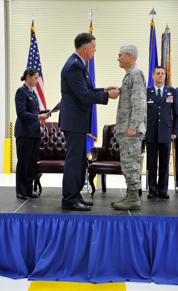 Maj. Gen. Wallace W. "Wade" Farris Jr., 22nd Air Force commander, presents Col. Craig L. LaFave, 403rd Wing vice commander, with the Legion of Merit award at Keesler AFB, Miss. Sep. 14, 2013.  The award was presented for LaFave's leadership and accomplishments while fulfilling the role of interim commander during the former 403rd Wing commander's deployment in Southwest Asia. (U.S. Air Force photo/ Tech. Sgt. Jessica Kendziorek)