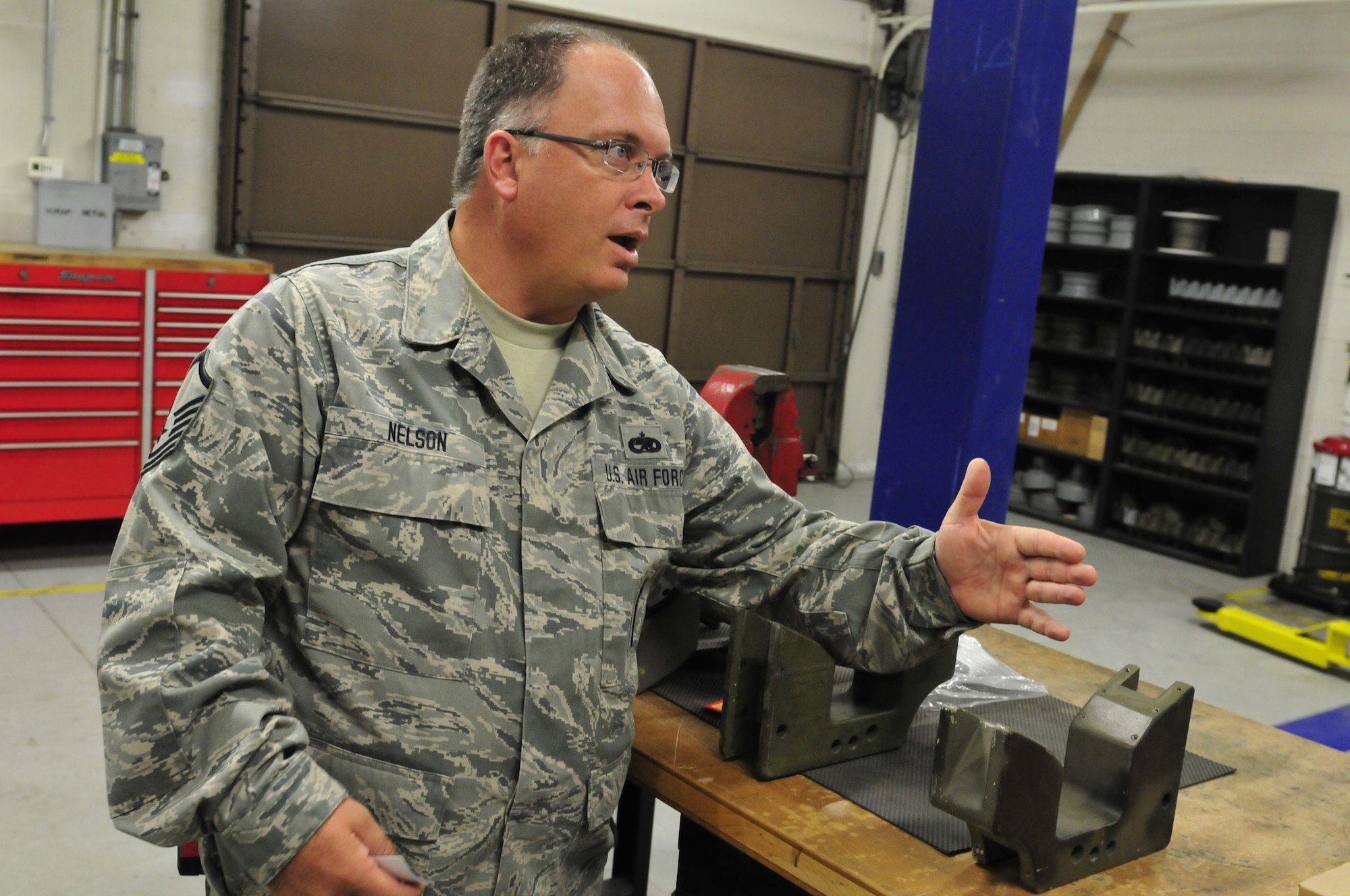 U.S. Air National Guard Master Sgt. Todd Nelson, equipment ordinance mechanic for the 125th Fighter Wing, describes the function of munition chalks for missile sets at Jacksonville IAP, Fla. on Sept. 14, 2013. U.S. Air National Guard Photo by Staff Sgt. Jeremy Brownfield. Released.