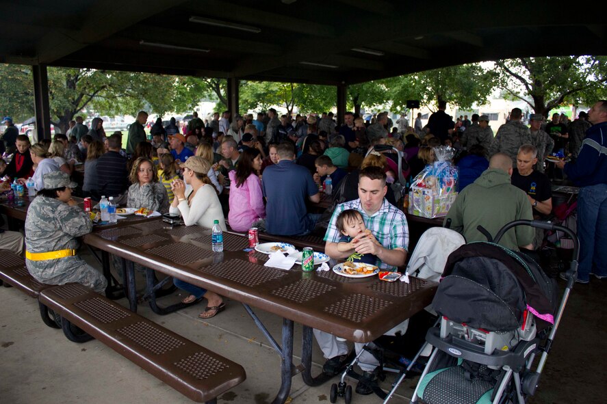 Reservists and their families pack under the pavilion at the base’s Centennial Park during a rainy Family Day. (U.S. Air Force photo/Tech. Sgt. Richard Gonzales)