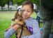 Josslynn, daughter of Staff Sgt. Erin Casillas from the 419th Maintenance Squadron, plays with a puppy during the wing’s Family Day here today. Ogden’s Pack N Pound Animal Rescue was one of many local organizations that showed up to support the wing event. (U.S. Air Force photo/Tech. Sgt. Richard Gonzales)