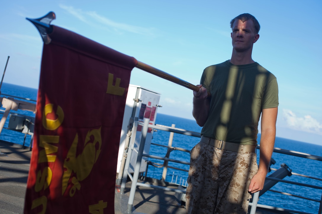 Corporal Dillon J. Spencer, a 23-year-old Combat Rubber Raiding Craft coxswain with Company F., Battalion Landing Team 2nd Battalion, 4th Marines, 31st Marine Expeditionary Unit, and a native of Deer Creek, Ill., executes a movement with the company’s guidon during a Corporals Course class on the bow of the ship here, Sept.14. Newly-promoted corporals of the company have been conducting the course periodically throughout the 31st MEU’s regularly-scheduled Fall Patrol. They began their class three months ago at Camp Hansen, Okinawa, Japan, and have adapted to the confines of the ship in order to continue training. The 31st MEU is the Marine Corps’ force in readiness for the Asia-Pacific region and is the only continuously forward-deployed MEU. 