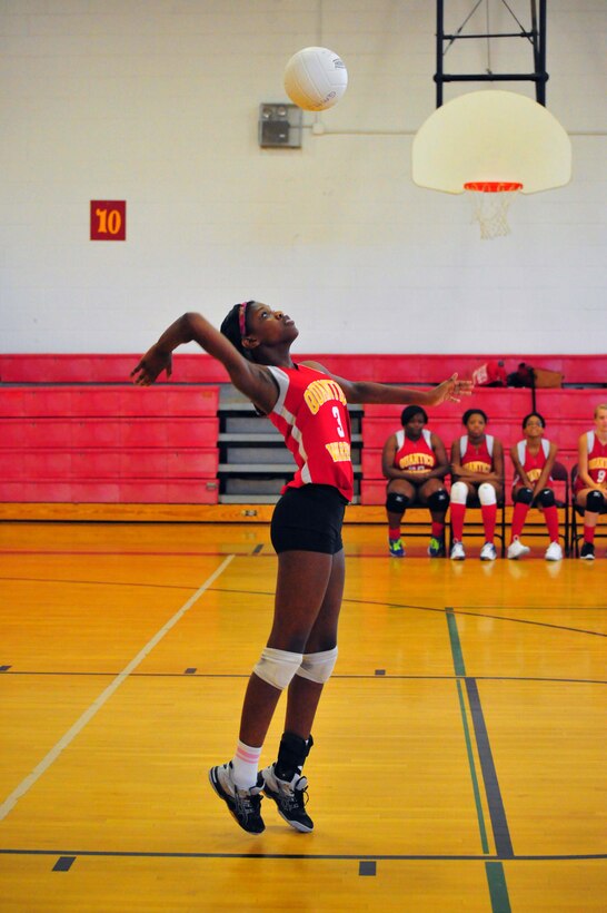 Aonjhne, junior, hits a ball during a volleyball game against Emmanuel Christian School at Quantico Middle/High School on Sept. 9, 2013. The Lady Warriors beat their opponent maintaining their undefeated 2013 record.