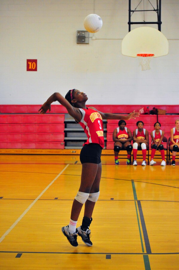 Aonjhne, junior, hits a ball during a volleyball game against Emmanuel Christian School at Quantico Middle/High School on Sept. 9, 2013. The Lady Warriors beat their opponent maintaining their undefeated 2013 record.