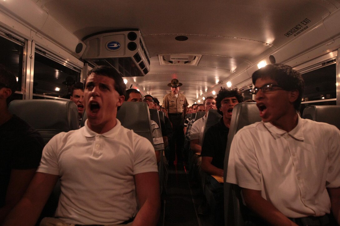 Staff Sgt. Nicholas Granter, a senior drill instructor, orders future recruits of Kilo Company, 3rd Recruit Training Battalion, to sit up straight and heed all commands following their arrival to training Aug. 26, 2013, on Parris Island, S.C. The first hour on the Island is one of many recruits will spend learning what it takes to earn the title of United States Marine. Granter, 28, from Mansfield, Ohio, is one of a handful of drill instructors responsible for preparing new recruits for training. Kilo Company is scheduled to graduate Nov. 22, 2013. Parris Island has been the site of Marine Corps recruit training since Nov. 1, 1915. Today, approximately 20,000 recruits come to Parris Island annually for the chance to become United States Marines by enduring 13 weeks of rigorous, transformative training. Parris Island is home to entry-level enlisted training for 50 percent of males and 100 percent of females in the Marine Corps. (Photo by Cpl. Caitlin Brink)