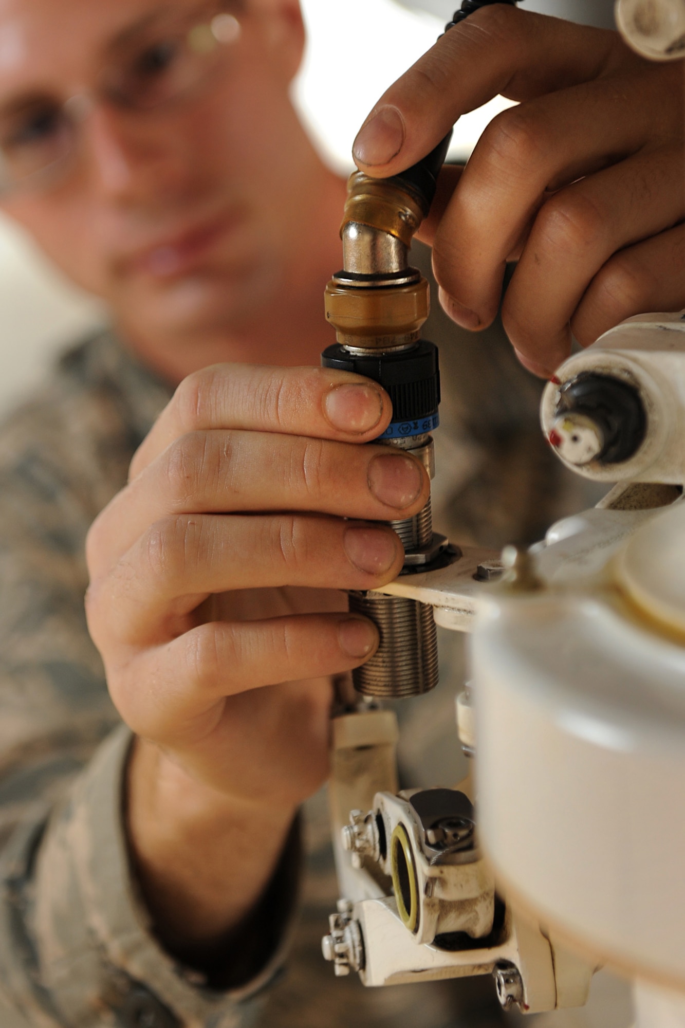 An Air Force maintainer provides maintanance on the F-35 Lightning II fighter during operations June 20, 2013, at Eglin Air Force Base, Fla. The F-35 will be used by the Air Force, Army, Marine Corps and other partner nations. 