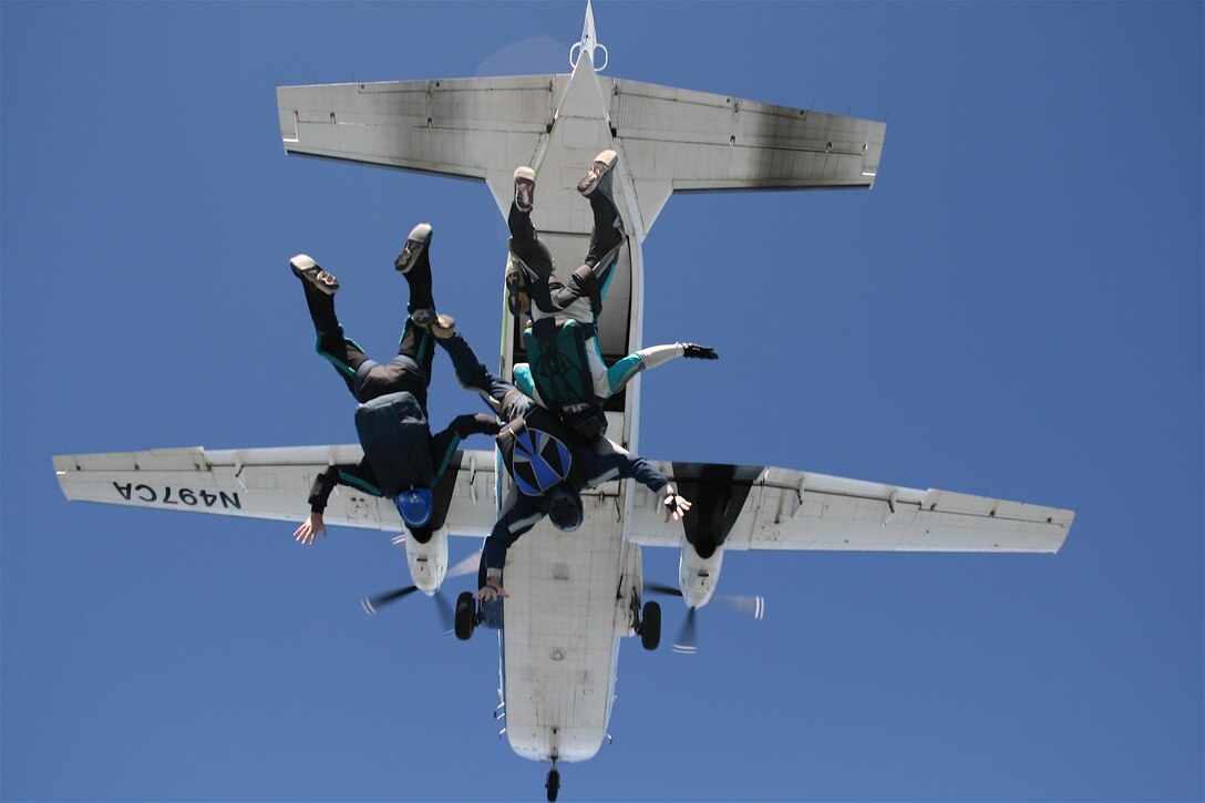 A group of skydivers exit from a CASA 212 aircraft over N.C. with Triangle Skydive Center in 2011. Photo by Don Carrington.