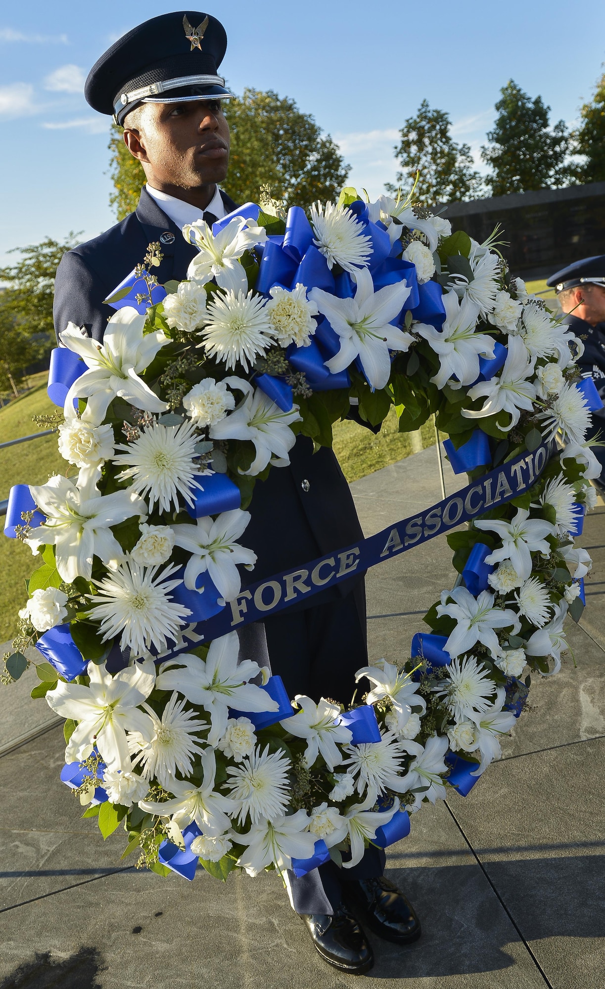 The Air Force's 12 Outstanding Airmen of the Year, Air Force senior leaders and Air Force Association members gathered for an early morning memorial service and wreath laying ceremony Sept. 15, 2013, at the Air Force Memorial Arlington, Va. Laying the wreath were Air Force Assistant Vice Chief of Staff Lt. Gen. Stephen Hoog,  Air Force Association Chairman of the Board Mr. George Muellner and Chief Master Sergeant of the Air Force James Cody. (U.S. Air Force photo/Jim Varhegyi)
