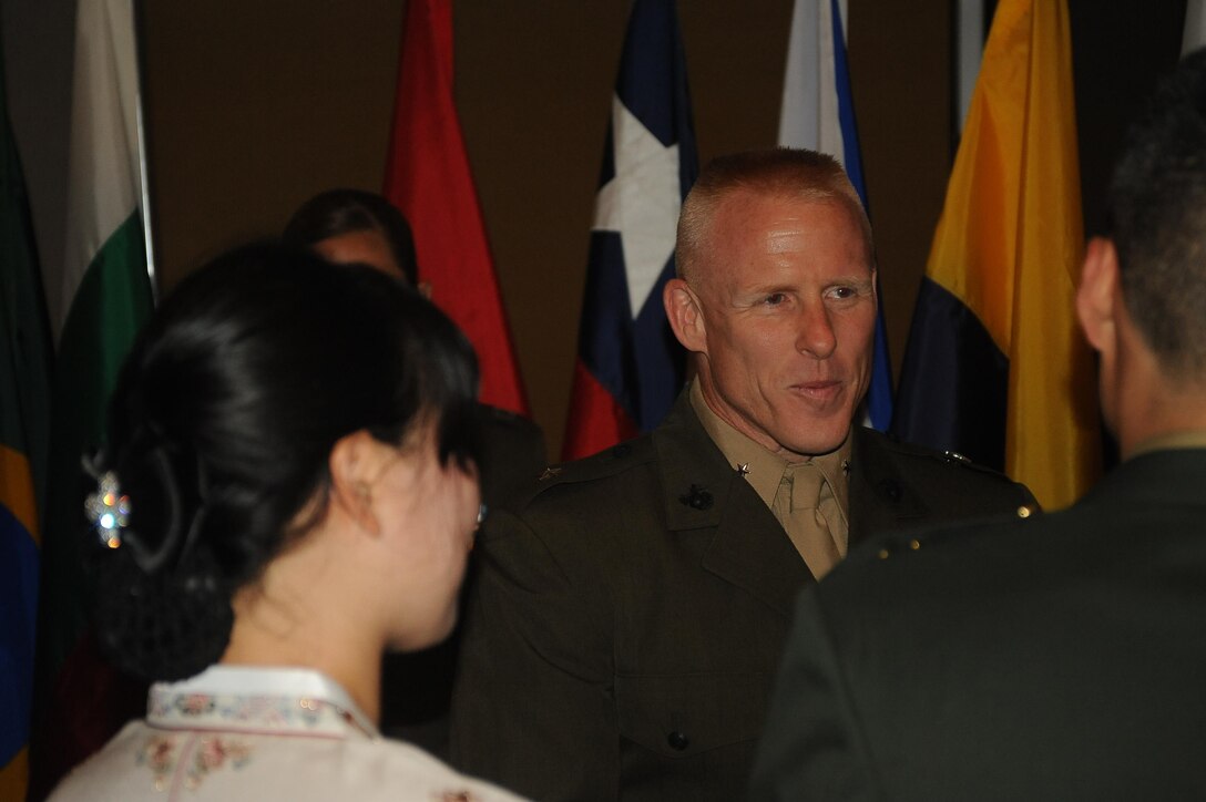 Brig. Gen. Thomas Loren, president, MCU, greets international officers during the Marine Corps University banquet at The Clubs at Quantico on Sept. 11, 2013. The banquet is held to show MCU appreciation for the international officers.