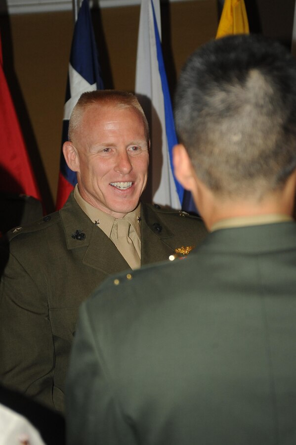 Brig. Gen. Thomas Loren, president, MCU, greets international officers during the Marine Corps University banquet at The Clubs at Quantico on Sept. 11, 2013. The banquet is held to show MCU appreciation for the international officers.